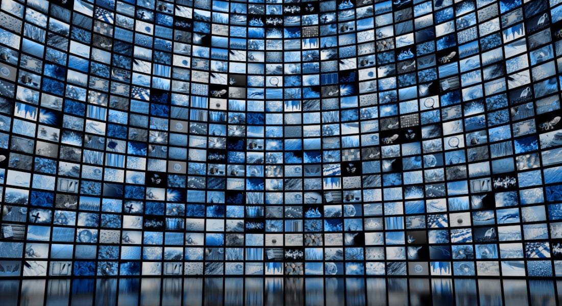 A large wall full of screens showing various images. Used as a concept for media regulation.