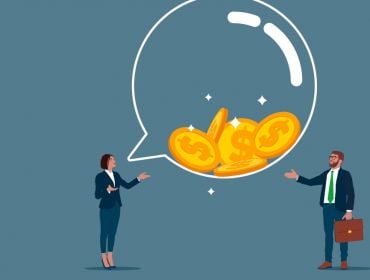 Cartoon showing one worker giving wise words of advice to another fintech worker. A big speech bubble is between them filled with gold coins.