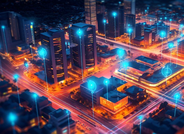 Illustration of a city with blue nodes scattered throughout. Used as a concept for edge computing and smart cities.