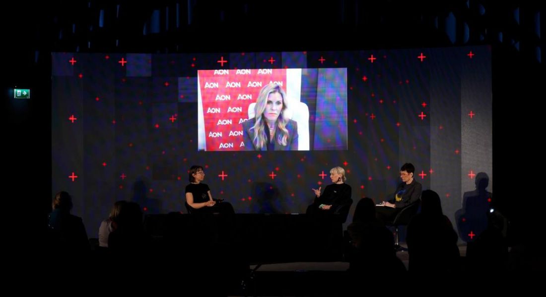Ann, Dee and Monica sit on stage, while Lisa dials in remotely, at a Future Human panel.
