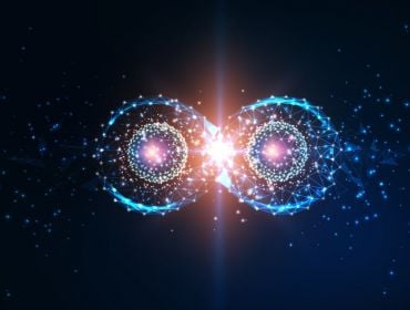 An image of what looks like two qubits touching, symbolising quantum computing and future physics concepts.